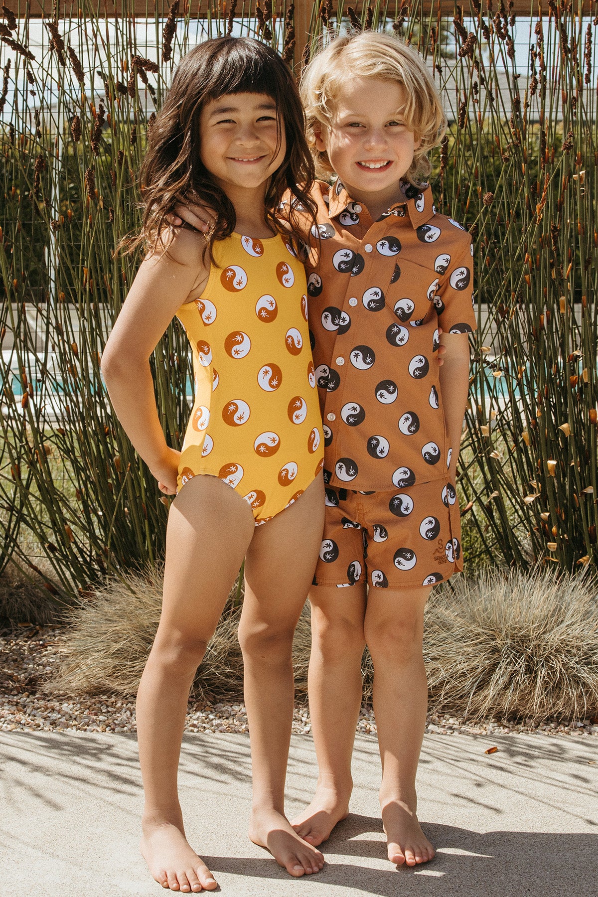 Board shorts over one piece shop